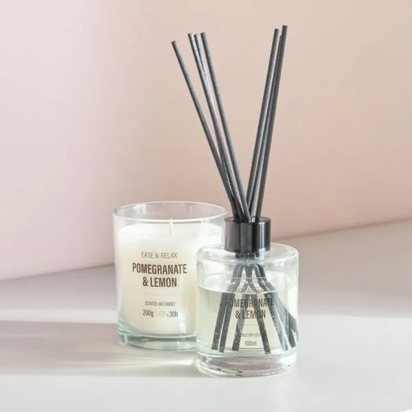 طقم هدايا شمعة معطرة وموزّع عطور برائحة الرمان والليمون - ويلنس